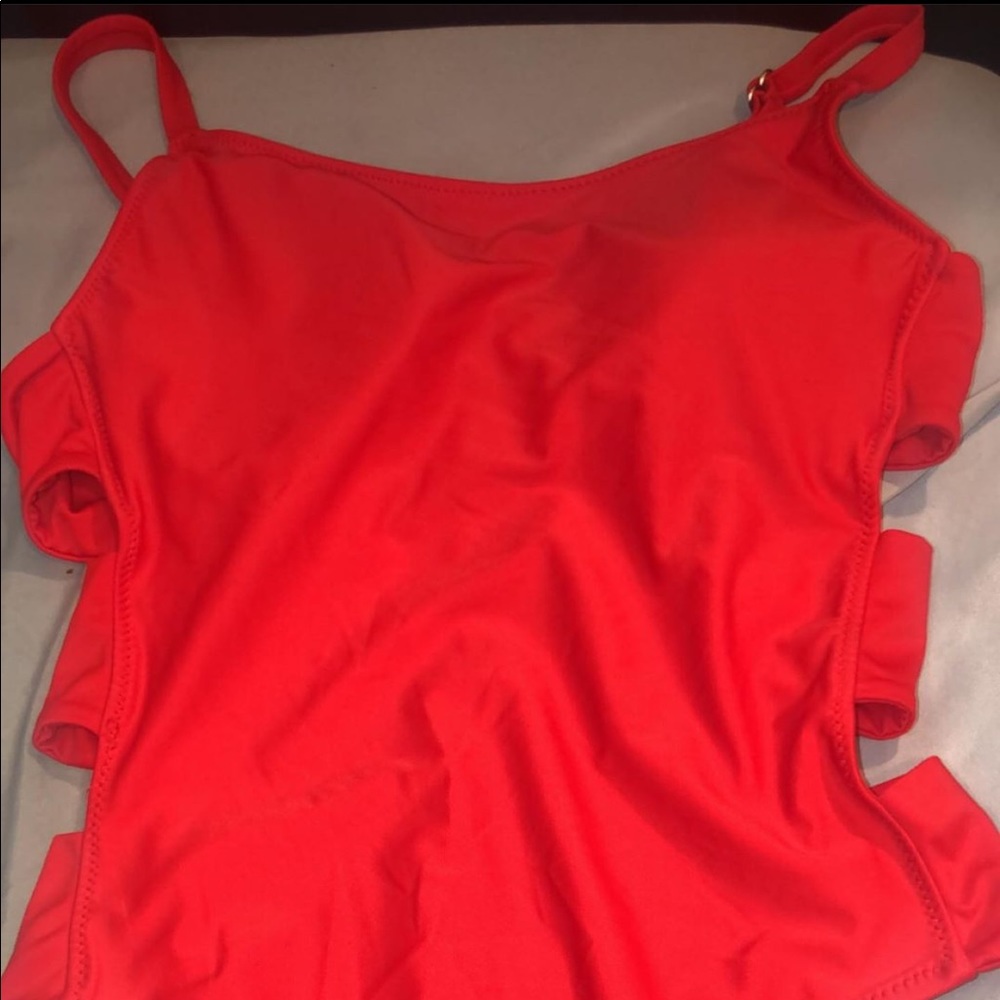 A red side cutout bathing suit